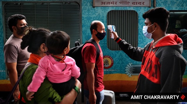Outstation passengers being screened on arrival at Dadar railway station, on Friday. (Express Photo by Amit Chakravarty)