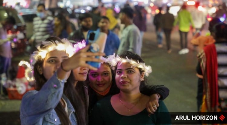 New Year Live Updates: People celebrate New Year's Eve on the streets of Pune.