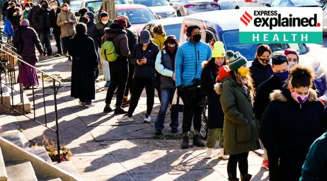 City residents wait in a line extending around the block to receive free at-home rapid COVID-19 test kits in Philadelphia. (AP Photo/Matt Rourke)
