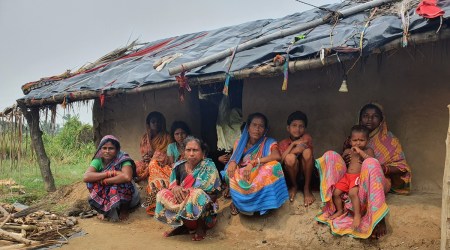 Sukanti Das (extreme right) along with other women outside their kutcha house in Khilakhotia village of Brahmagiri block | Express photo by Aishwarya Mohanty