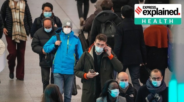 Commuters wearing face masks to protect against Covid-19 while walking through the La Defense business district transportation hub in Paris, Wednesday, Dec. 8, 2021. (AP Photo/Michel Euler)


