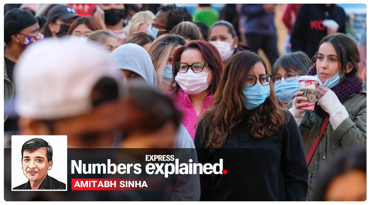 Shoppers wearing face masks wait in line to enter a store at the Citadel Outlets in Commerce, California. (AP Photo/Ringo H.W. Chiu, File)