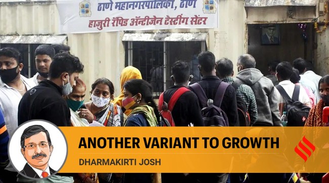 People wait to get tested for Covid-19 outside Thane station.
(Express photo/Deepak Joshi)