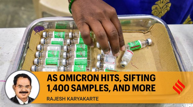 A health worker sorts empty vials during a vaccination drive, amid fears of the new Omicron variant, in Bengaluru. (PTI)