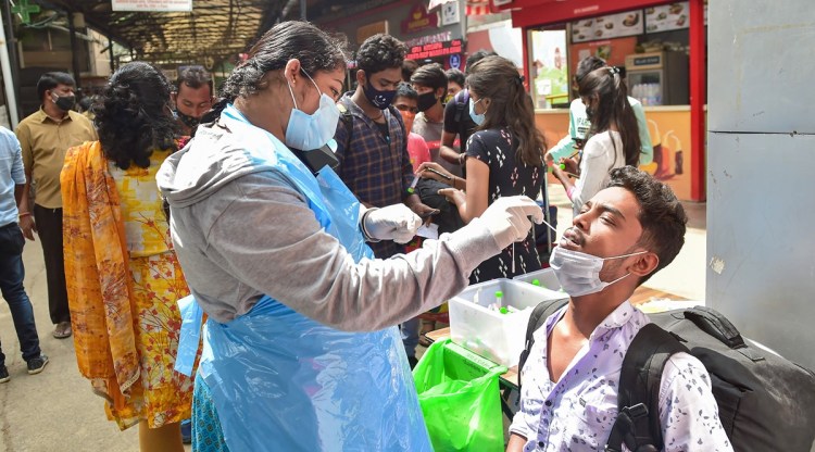 A health worker conducts Covid-19 testing of commuters. (Representational image/PTI)