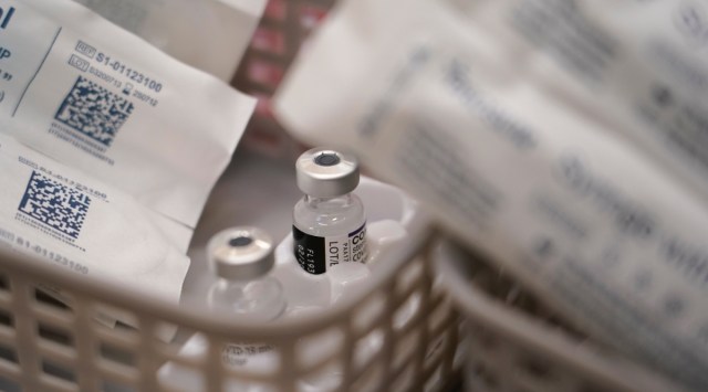 Vials of the Pfizer Covid-19 vaccine ready to be administered in London, Saturday, Dec. 4, 2021. (AP Photo/Alberto Pezzali)
