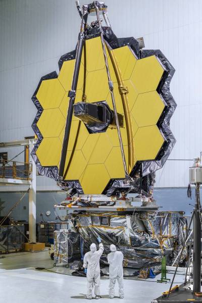 A photo provided by NASA, of the primary mirror of the James Webb Space Telescope at Goddard Space Flight Center in Greenbelt, Md., in 2016. Once the telescope is launched, it will unfold in a series of movements that ends with the 18 gold-plated hexagons of the mirror snapped into place. (Chris Gunn/NASA) (Chris Gunn/NASA)