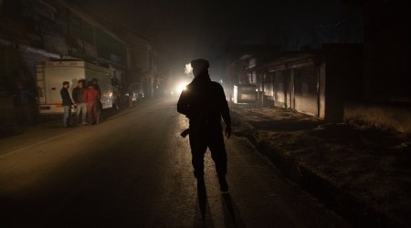 An Indian soldier stands guard near the site of an attack on the outskirts of Srinagar, Monday, Dec. 13, 2021. (AP Photo/Mukhtar Khan)


