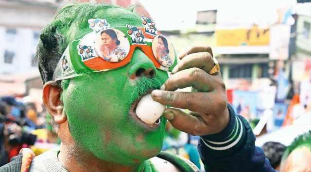 Winning Taste: A TMC supporter celebrates the party’s landslide victory in the Kolkata civic polls on Tuesday. (Photo: Partha Paul)