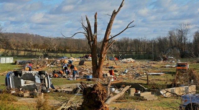Friends and family search for survivors after a tornado ripped through the middle of the US. (Photo: AP)