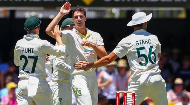 Australia's Pat Cummins, is congratulated by teammates after taking a wicket. (AP)