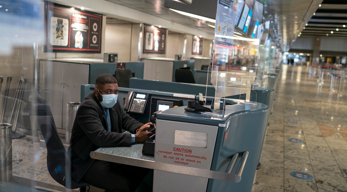 With many flights cancelled, there is little traffic at international check-in counters in OR Tambo International Airport, Johannesburg on Dec. 2, 2021. (Joao Silva/The New York Times)