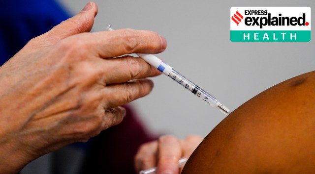 A health worker administers a dose of a Covid-19 vaccine. (AP)
