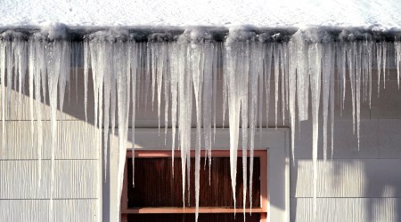 The heavy snows were followed by torrents of rain that coated communities in the region with ice, triggering widespread power outages and prompting closures of major roads and offices.  (AP)