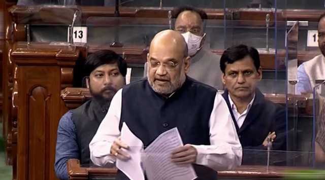 Union Home Minister Amit Shah speaks in the Lok Sabha during ongoing Winter Session of Parliament, in New Delhi, Monday, Dec. 6, 2021. (LSTV/PTI Photo)