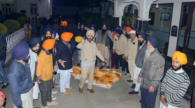 Activists of various Sikh organisations gather outside the Golden Temple after a man was beaten to death at the temple premises for alleged sacrilege. (PTI)