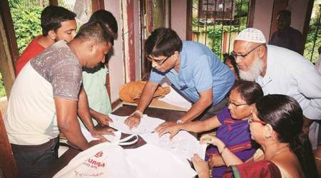 People check their names in the final list at an NRC centre in Guwahati. (File Photo)