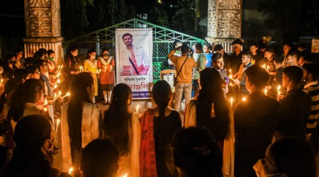 Students of the Cotton University light candles to pay tribute to All Assam Students’ Union (AASU) leader Animesh Bhuyan, who was lynched by a mob following an alleged road accident in Assam’s Jorhat district, in Guwahati, Tuesday, Nov. 30, 2021. (PTI Photo)