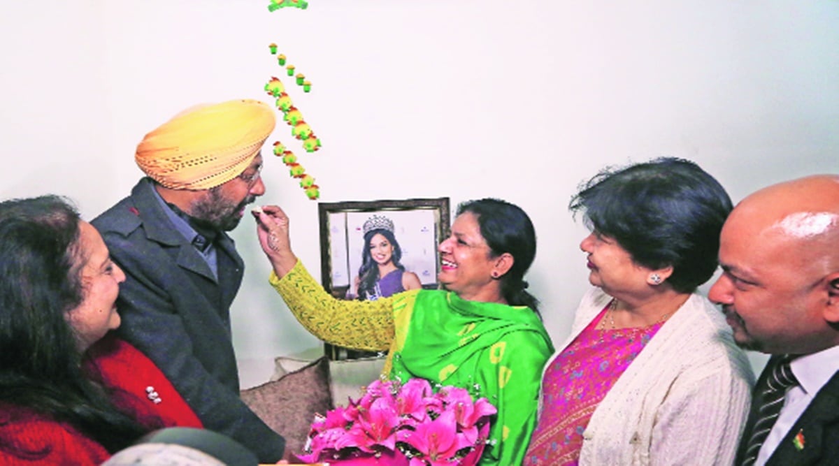 Family members of Miss Universe Harnaaz Sandhu  celebrate her victory in Kharar on Monday. Photo: Jasbir Malhi 