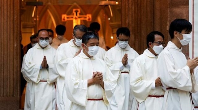Catholic priests leave the church after the episcopal ordination of Bishop Stephen Chow in Hong Kong, China December 4, 2021. (Reuters)
