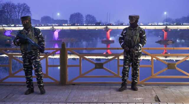 Security personnel stand guard during high alert after a millitant attack at Zewan in which 3 policemen were killed and 11 others were injured, in Srinagar, Tuesday, Dec. 14, 2021. (PTI Photo)