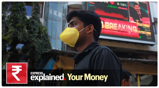 A man walks past the BSE in Mumbai. (Express Photo: Pradip Das, File)