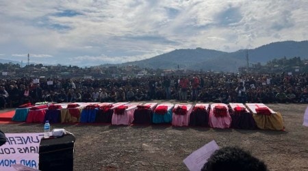 The coffins of people killed by Indian army soldiers on Dec 4, who mistakenly believed some of them were militants, and one who was killed when soldiers fired at a crowd of protestors on Sunday, are laid out in a row during a public funeral in Mon, in the northeastern Indian state of Nagaland, Monday, Dec. 6, 2021. (AP Photo/Fifi Konyak)