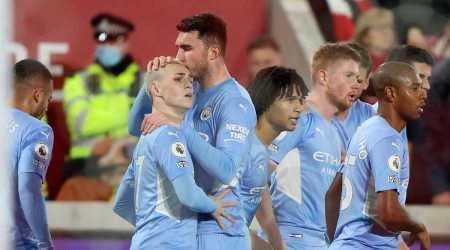 Manchester City's Phil Foden celebrates after scoring the opening goal during the English Premier League soccer match between Brentford and Manchester City at the Brentford Community Stadium in London (Source: AP)
