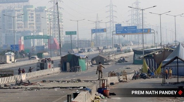 Clean-up continues at Ghazipur border. Police said roads will be cleared once all protesters have left the site. (Express Photo by Prem Nath Pandey)