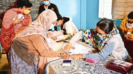 Gangaben Ajani, believed to be 100 years old, at a polling booth near Rajkot on Sunday. (Photo: Chirag Chotaliya)