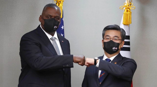 US Secretary of Defense Lloyd Austin, left, bumps elbows with South Korean Defense Minister Suh Wook in Seoul, South Korea on Dec 2, 2021. (AP)