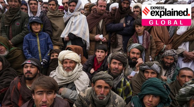 Hundreds of Afghan men gather to apply for the humanitarian aid in Qala-e-Naw, Afghanistan, on Dec. 14, 2021. As winter deepens, a grim situation in Afghanistan is getting worse. (AP)