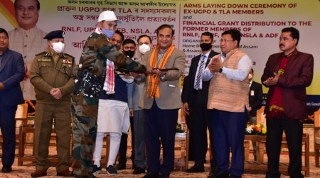 A militant laying down arms in a ceremony in Guwahati. (Photo: Twitter@himantabiswa)