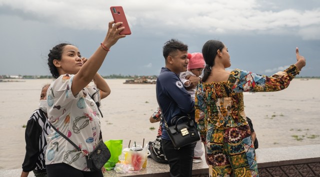 People at Riverside Park in Phnom Penh, Cambodia, Nov 14, 2021.  (Cindy Liu/The New York Times)