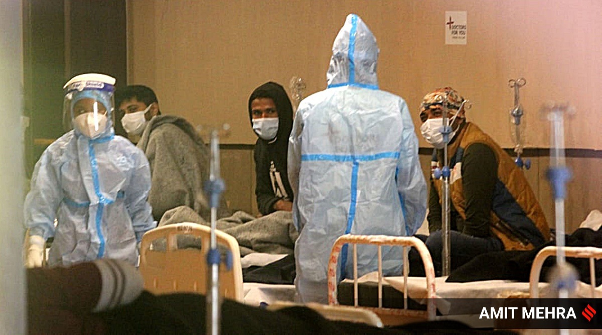 Covid patients receive treatment inside Shehnai banquet hall, converted into a Covid-19 isolation center, in New Delhi. (Expres Photo By Amit Mehra)
