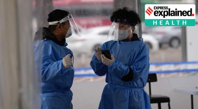 Health workers wearing protective gear prepare for visitors at a temporary screening clinic for the coronavirus in Seoul, South Korea, Tuesday, Jan. 25, 2022. (AP Photo/Lee Jin-man)


