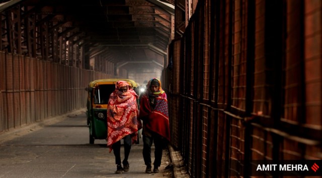 A cold and foggy morning in Anand Vihar, New Delhi. (Express Photo: Amit Mehra, File)