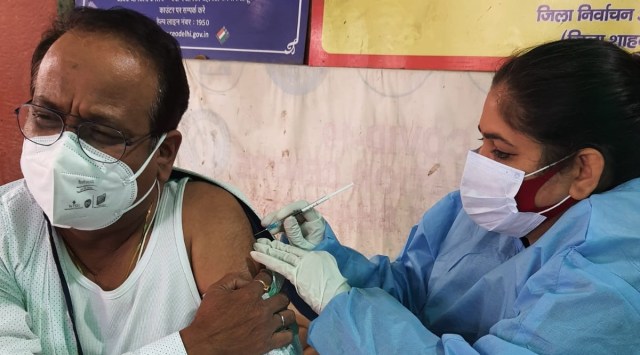 Dr Gopal Jha takes the third dose of the Covid-19 vaccine (Express)
