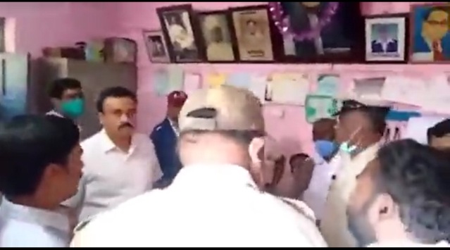 A screengrab of the video that shows police and school officials. 