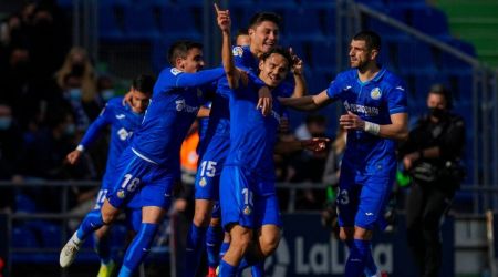 Getafe players celebrate after scoring the opening goal during the La Liga soccer match between Real Madrid and Getafe at Coliseum Alfonso Perez stadium in Getafe, Spain, Sunday, Jan. 2, 2022. (AP Photo/Bernat Armangue)
