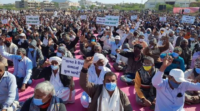 Farmers hold a protest in Bhuj on Tuesday. (Express Photo) 