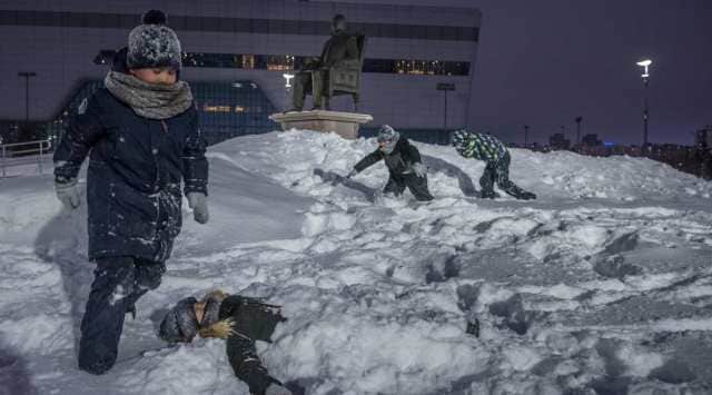 Children play next to a statue of Kazakhstan’s former president, Nursultan Nazarbayev, in Nur-Sultan, the capital that was renamed in his honor, Jan. 17, 2022. For three decades, Nazarbayev was seemingly everywhere in Kazakhstan, the country he ruled with an autocrat’s clenched fist. (Sergey Ponomarev/The New York Times)