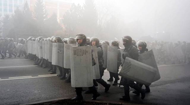 Riot police walk to block demonstrators during a protest in Almaty, Kazakhstan, Wednesday, Jan. 5, 2022. (AP)