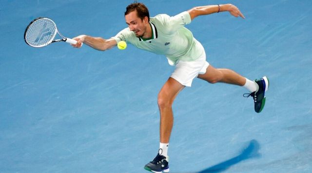 Daniil Medvedev of Russia plays a forehand to Rafael Nadal of Spain during the men's singles final at the Australian Open tennis championships in Melbourne, Australia, Sunday, Jan. 30, 2022. (AP Photo/Tertius Pickard)