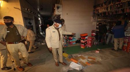 Police shutting down Shastri market Sector 22 due to new Covid-19 guidelines in Chandigarh on Friday. (Express Photo by Jasbir Malhi)