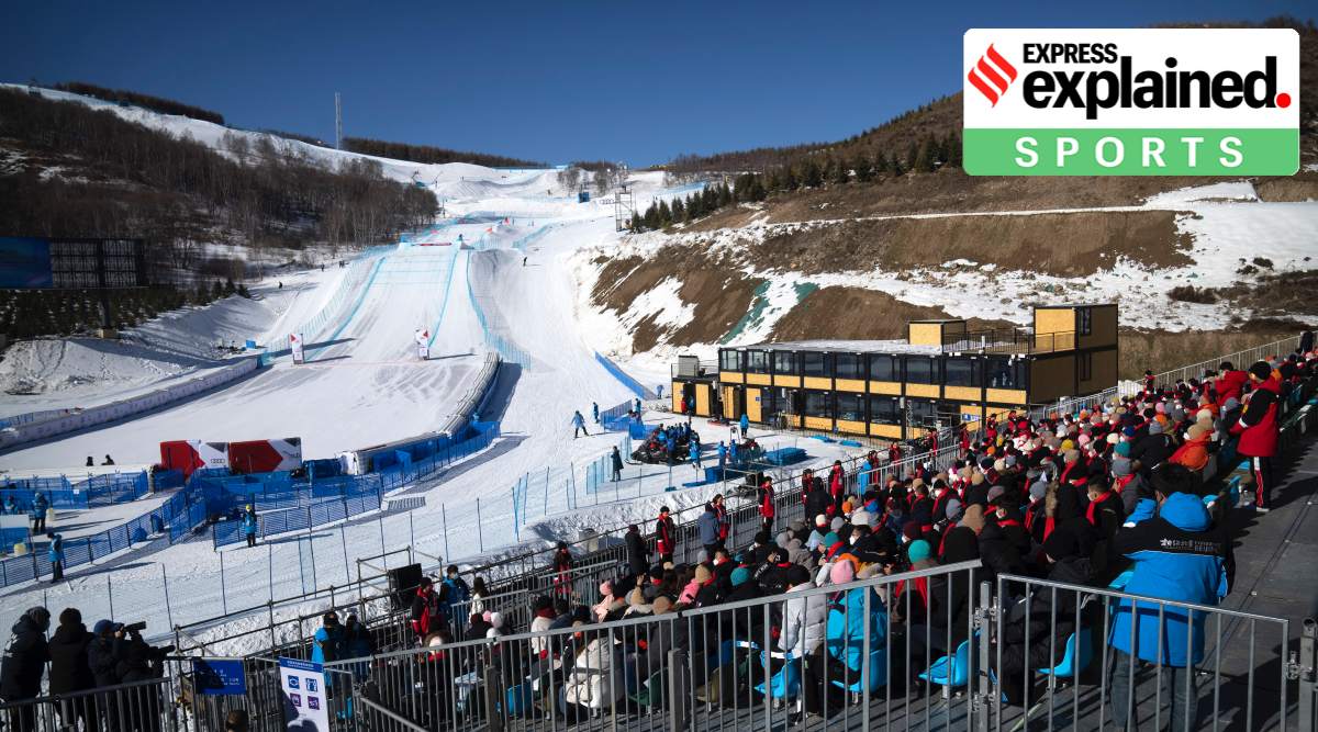 Spectators sit in the stands at Zhangjiakou Genting Snow Park in Zhangjiakou. The venue will host the freestyle skiing and snowboard competitions at the Beijing Winter Olympics. (AP Photo/Mark Schiefelbein)


