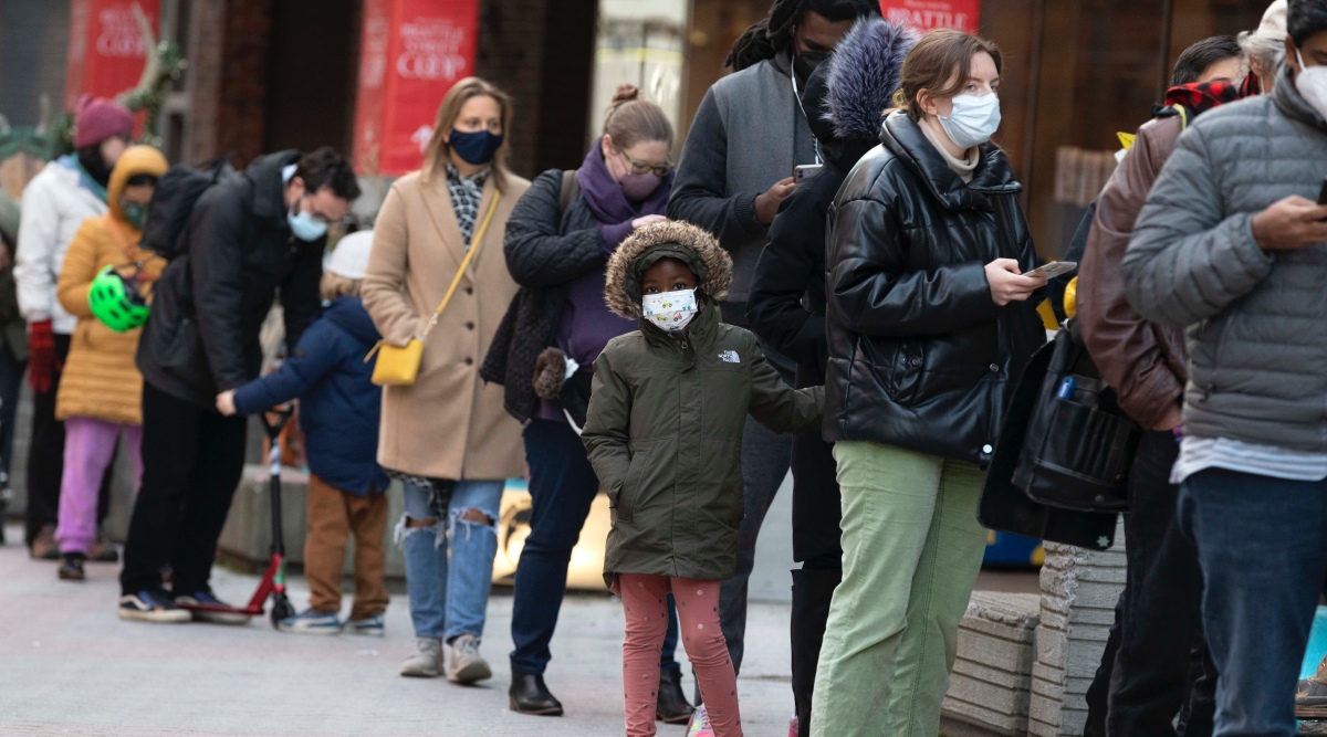 People wait in line outside a COVID-19 walk-in testing site, Dec. 5, 2021, in Cambridge, Mass. The fast-moving omicron variant may cause less severe disease on average, but COVID-19 deaths in the U.S. are climbing and modelers forecast 50,000 to 300,000 more Americans could die by the time the wave subsides in mid-March. (AP Photo/Michael Dwyer, File)


