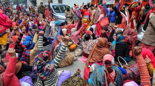 Anganwadi workers demonstrate in front of the residence of District BJP Chief Gargi Kakkar, in Gurugram, Monday, January 17, 2022. (PTI Photo)