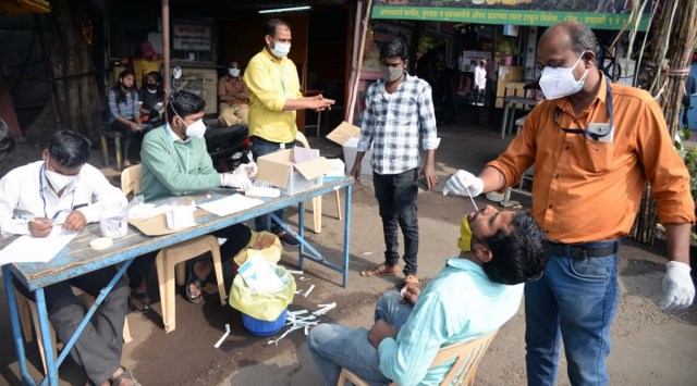 Medical staff of PCMC conduct random covid-19 antigen tests at Nigadi on Friday. (Express photo by Rajesh Stephen)