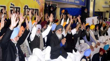 Former Punjab chief minister Parkash Singh Badal with SAD president Sukhbir Singh Badal and party leaders, during 'Panthic Rosh Ikath' to protest against the alleged police inaction in sacrilege cases, in Amritsar, Sunday.  (Express photo by Rana Simranjit Singh)